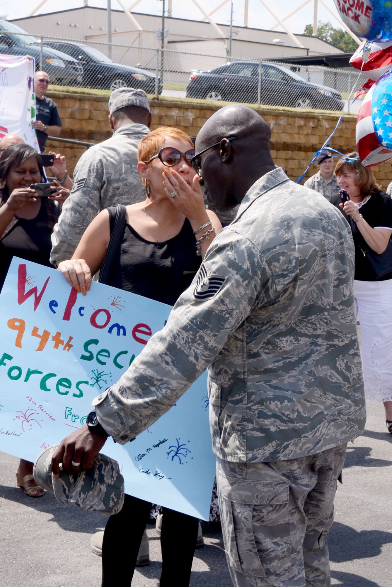 Members of the 94th Security Forces Squadron were received with open arms by family, friends, and fellow reservists as they arrive back on Dobbins Air Reserve Base, Ga., from deployment to the Middle East Sep. 3. (U.S. Air Force photo/Don Peek)