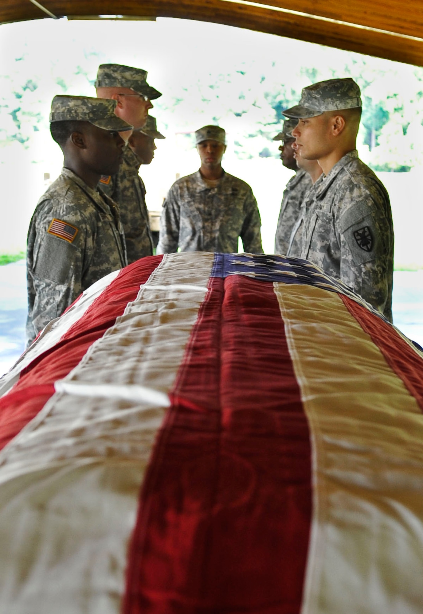 Members of the Fort Eustis Honor Guard pall bearer team prepare to practice a casket carry at Fort Eustis, Va., Aug. 27, 2013. The Honor Guard practices everyday to ensure their movements are crisp and in sync. (U.S. Air Force photo by Staff Sgt. Wesley Farnsworth/Released)
