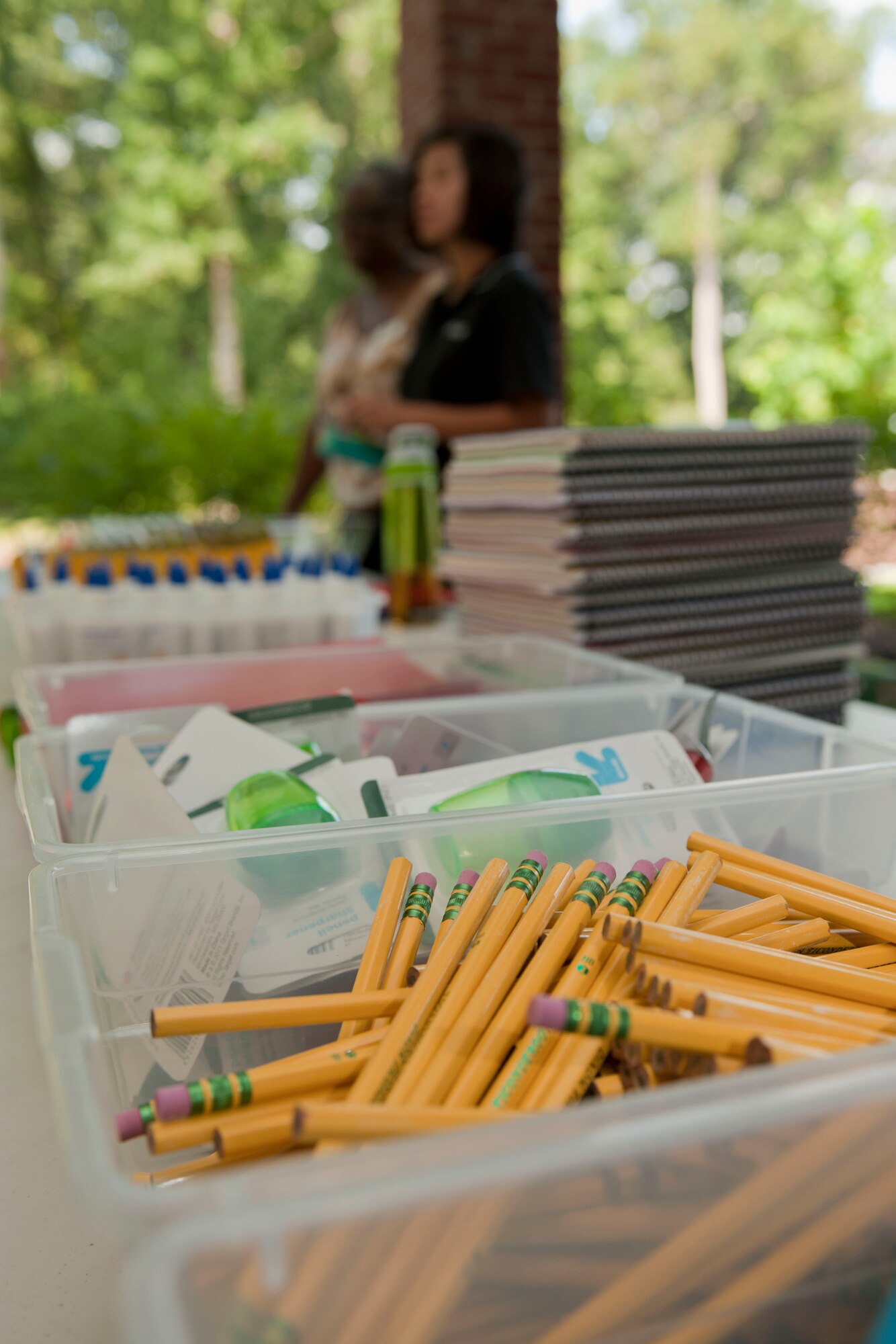 School supplies are distributed to children of Service members who currently reside in base housing, during the Langley Air Force Base Back to School Celebration in Hampton, Va., Aug. 29, 2013. The supplies were donated by the Langley AFB Housing office. (U.S. Air Force photo by Staff Sgt. Stephanie Rubi/Released)