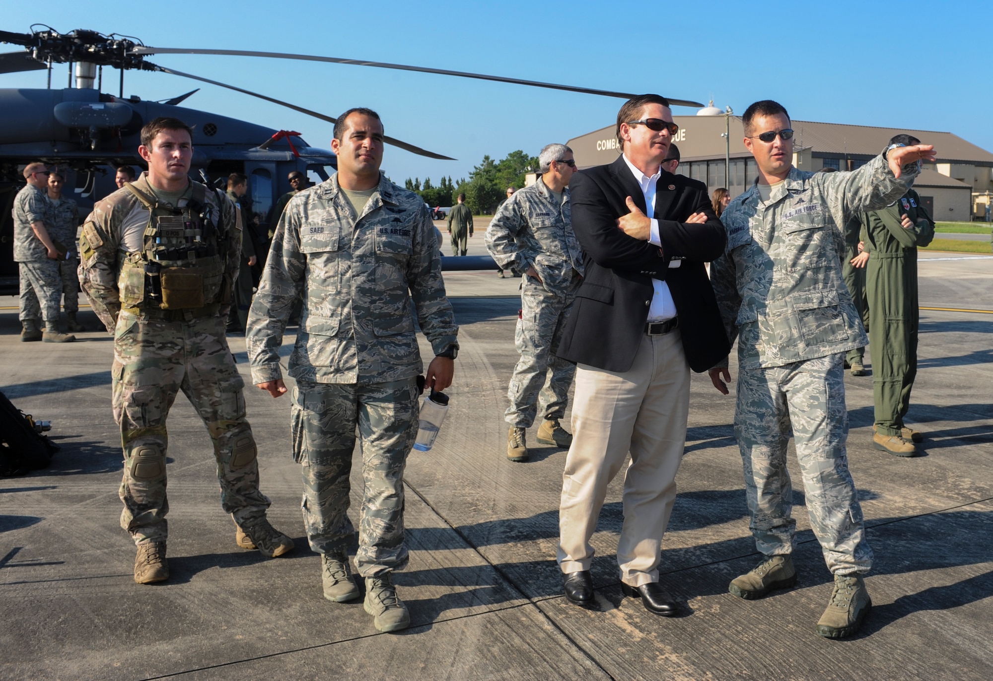 U.S. Rep Austin Scott (middle) learns about the qualifications to become a pararescueman at Moody Air Force Base, Ga., Sept. 4, 2013. Pararescuemen are trained to rescue personnel from any location at anytime. (U.S. Air Force photo by Airman Alexis Grotz/Released)