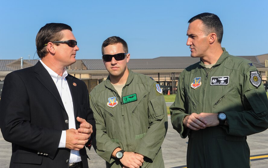 U.S. Air Force Col. Steven Gregg (right), 347th Rescue Group commander, and Capt. Kevin Pieper (middle), 41st Rescue Squadron HH-60G Pave Hawk pilot, explain Moody’s rescue assets to U.S.  Rep. Austin Scott at Moody Air Force Base, Ga., Sept. 4, 2013. Scott learned about the different weapons that the HH-60G carries as well as aerial refueling procedures for the aircraft. (U.S. Air Force photo by Airman Alexis Grotz/Released)