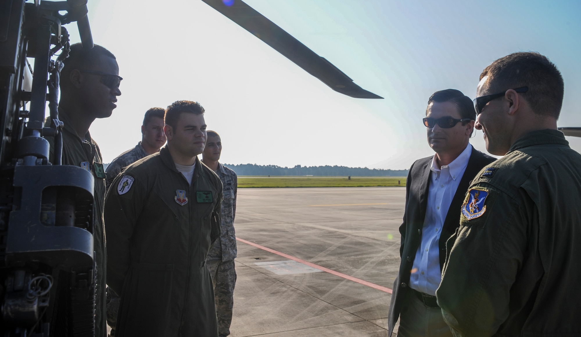 U.S. Air Force Capt. Kevin Pieper, 41st Rescue Squadron HH-60G Pave Hawk pilot, introduces Airmen to U.S. Rep. Austin Scott at Moody Air Force Base, Ga., Sept. 4, 2013. Pieper also spoke about the 50-caliber machine gun mounted on the HH-60. (U.S. Air Force photo by Airman Alexis Grotz/Released)