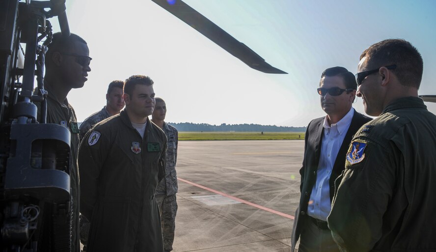 U.S. Air Force Capt. Kevin Pieper, 41st Rescue Squadron HH-60G Pave Hawk pilot, introduces Airmen to U.S. Rep. Austin Scott at Moody Air Force Base, Ga., Sept. 4, 2013. Pieper also spoke about the 50-caliber machine gun mounted on the HH-60. (U.S. Air Force photo by Airman Alexis Grotz/Released)