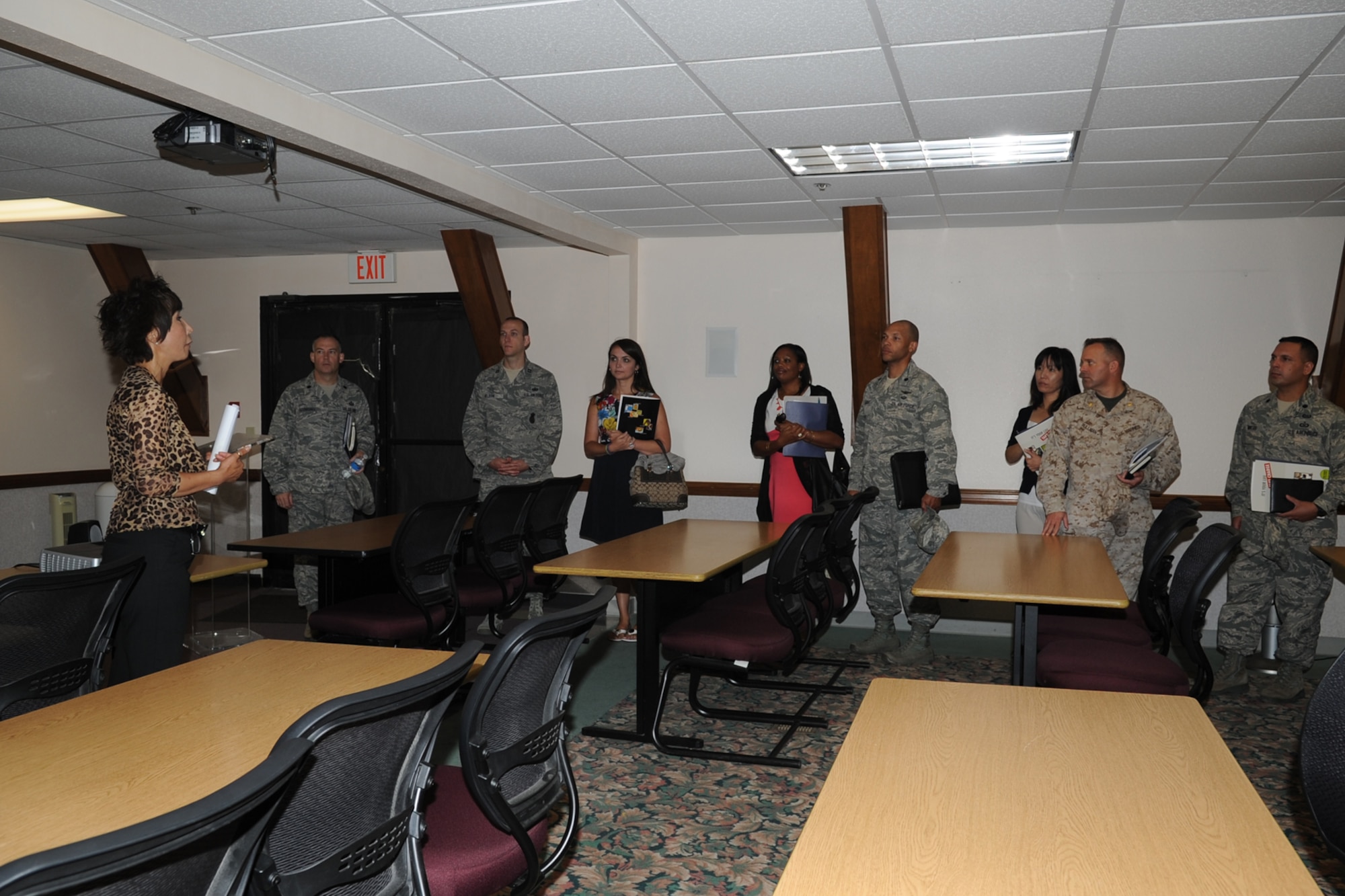 GOODFELLOW AIR FORCE BASE, Texas -- Joon Auci, Airman and Family Readiness Center acting director, shows new commanders around the AFRC Aug. 28 during a two day immersion seminar. A few locations visited were the Louis F. Garland Department of Defense Fire Academy, the Crossroads Student Center, Taylor Chapel, and the Airman and Family Readiness Center. (U.S. Air Force photo/Staff Sgt. Laura R. McFarlane)