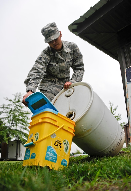 Airman 1st Class Jacqueline Douglas, 87th AMDS Public Health Flight technician, pours "stink water" into a Gravid trap Aug. 19, 2013, at Joint Base McGuire-Dix-Lakehurst, N.J. Gravid traps use the "stink water," a yeasty water substance which attracts female mosquitoes who wish to lay eggs.



 