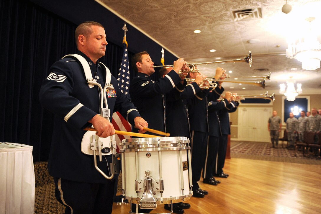 Technical Sergeant Dan Bragdon, performing on snare drum, and members of Offutt Brass perform the National Anthem at a recent Fifty Fifth Wing promotion ceremony
(U.S. Air Force photo by Josh Plueger).
