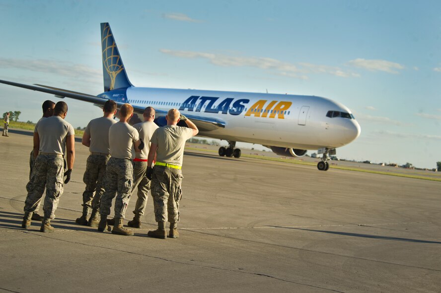 Airmen from the 23rd Bomb Squadron, 5th Maintenance Group and other units throughout Minot Air Force Base returned home, Sept. 1, from a deployment to Andersen AFB, Guam.  Their five-month deployment to Andersen AFB was in direct support of U.S. Pacific Command’s Continuous Bomber Presence designed to enhance security in the Asia-Pacific region by providing prudent deterrent capability. (U.S. Air Force photo/Senior Airman Brittany Y. Auld)