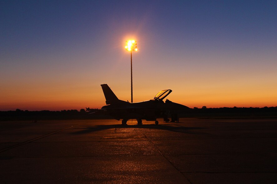 The sun rises over an F-16 from Homestead at Barksdale AFB during Operation Green Flag, Aug. 17. (U.S. Air Force photo/ Master Sgt. Charles White)