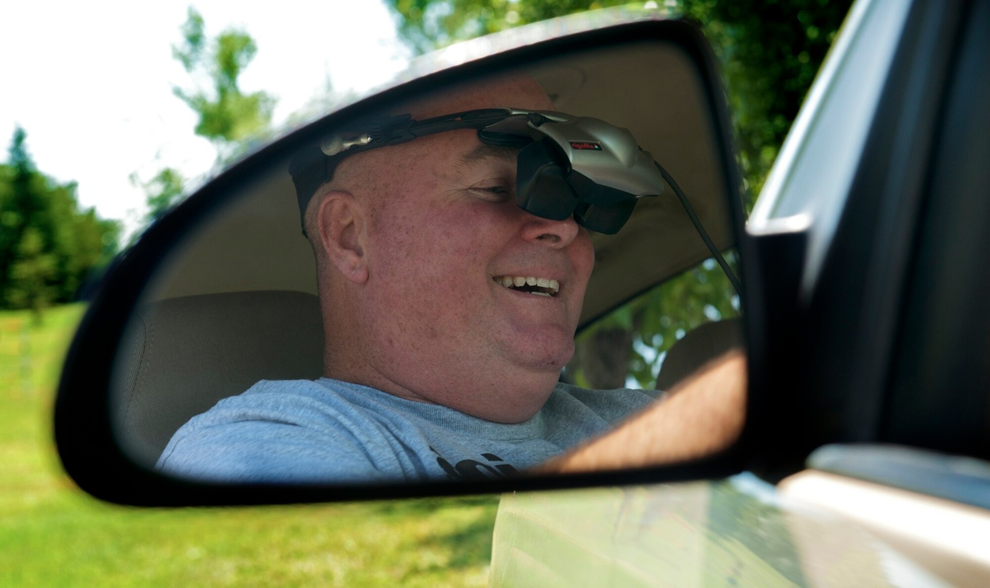 Col. William Tyra, 5th Medical Group commander, participates in an impaired driving simulation during a 5th MDG picnic, Aug. 16. The simulator will be distributed to all the squadrons on base throughout the next month to raise awareness about the risks of driving while impaired. (U.S. Air Force photo/Airman 1st Class Apryl Hall)