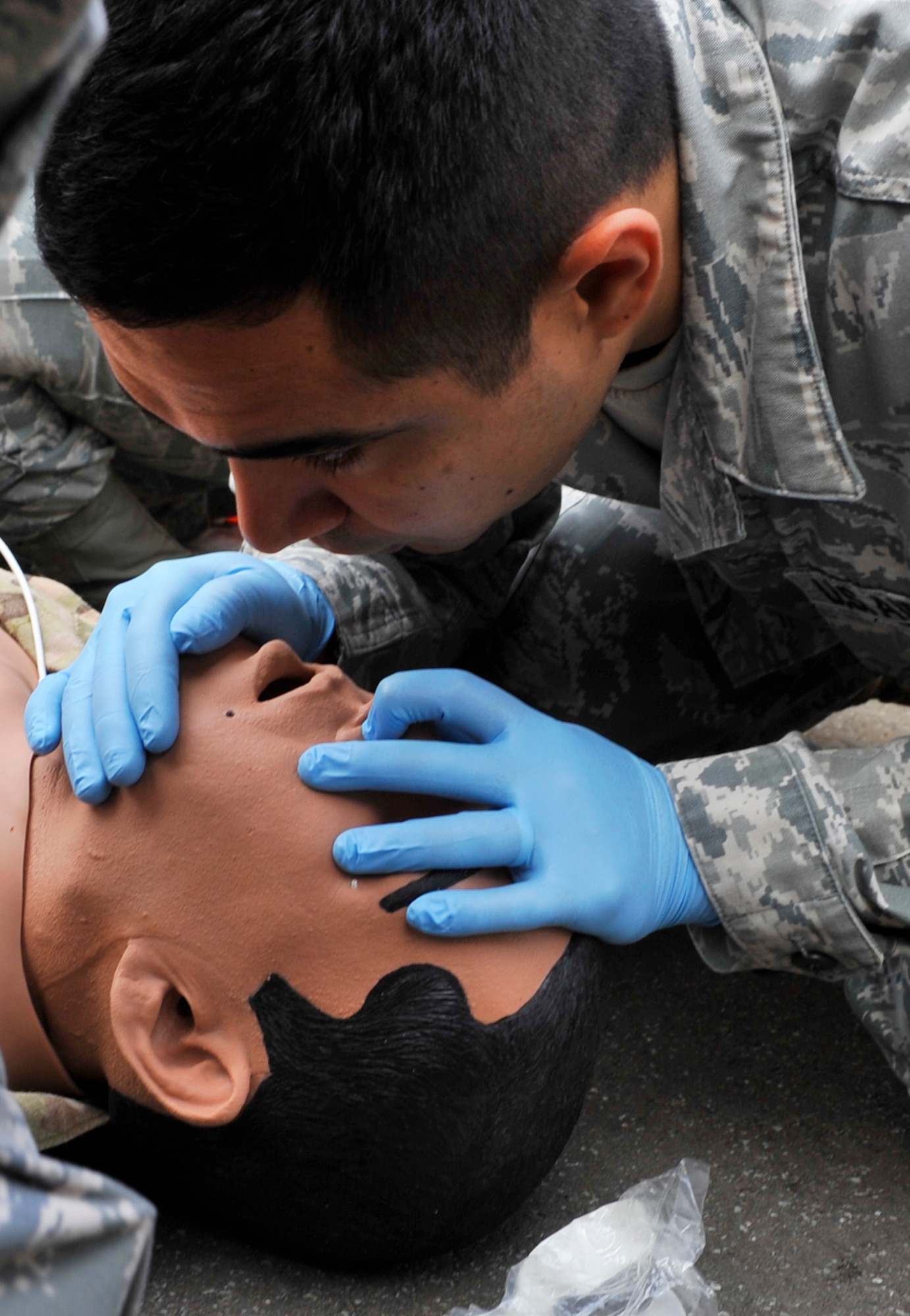 An Airmen demonstrates cardiopulmonary resuscitation during Expeditionary Medical Support training Aug. 28, 2013, Ramstein Air Base, Germany. EMEDS training is conducted to prepare Airmen for humanitarian missions. (U.S. Air Force photo/Airman Dymekre Allen)