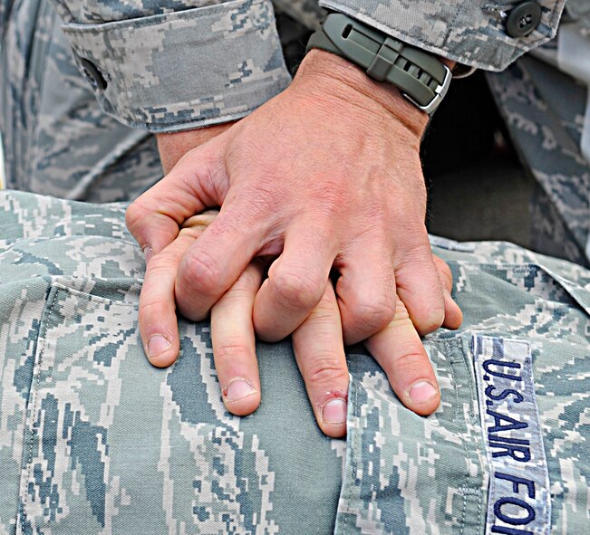 An Airmen demonstrates cardiopulmonary resuscitation during Expeditionary Medical Support training Aug. 28, 2013, Ramstein Air Base, Germany.  EMEDS training is conducted to prepare Airmen for humanitarian missions. (U.S. Air Force photo/Airman Dymekre Allen)