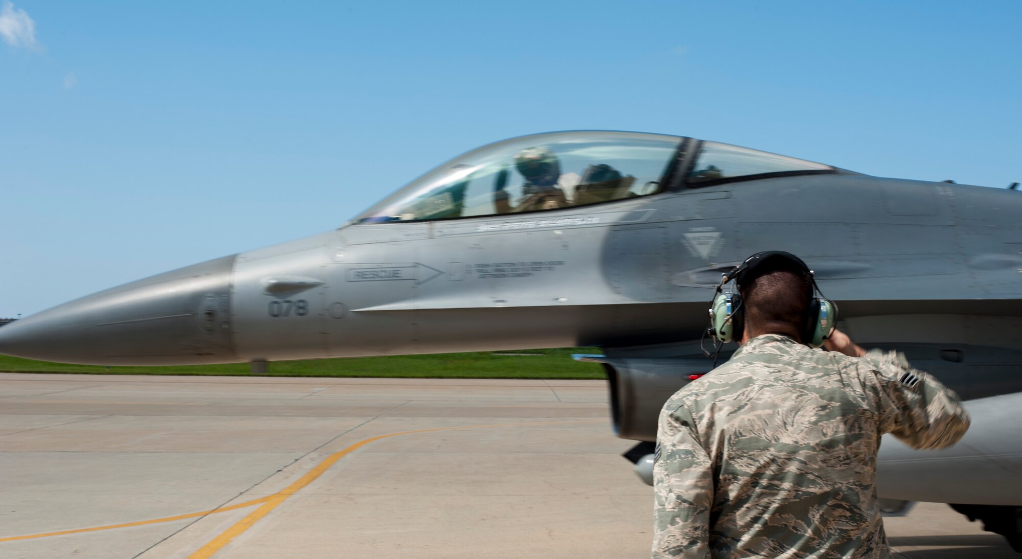 KUNSAN AIR BASE, Republic of Korea -- Senior Airman Joshua Gorman, 8th Maintenance Group crew chief, gives a salute to his assigned aircraft Aug. 14, 2013. Gorman prepared the F-16 Fighting Falcon to fly in a formation promoting cooperation between the U.S. Air Force and the Republic of Korea air force.  (U.S. Air Force photo by Senior Airman Armando A. Schwier-Morales/ Released)