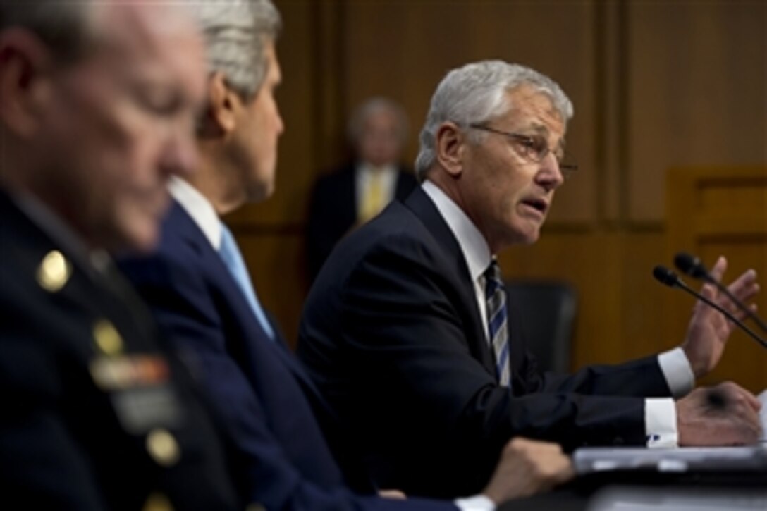 Secretary of Defense Chuck Hagel testifies on U.S. military intervention in Syria before the Senate Foreign Relations Committee at the Senate Hart Office Building in Washington, D.C., on Sept. 3, 2013.  Secretary of State John F. Kerry and Chairman of the Joint Chiefs of Staff Gen. Martin E. Dempsey joined Hagel for the testimony.  