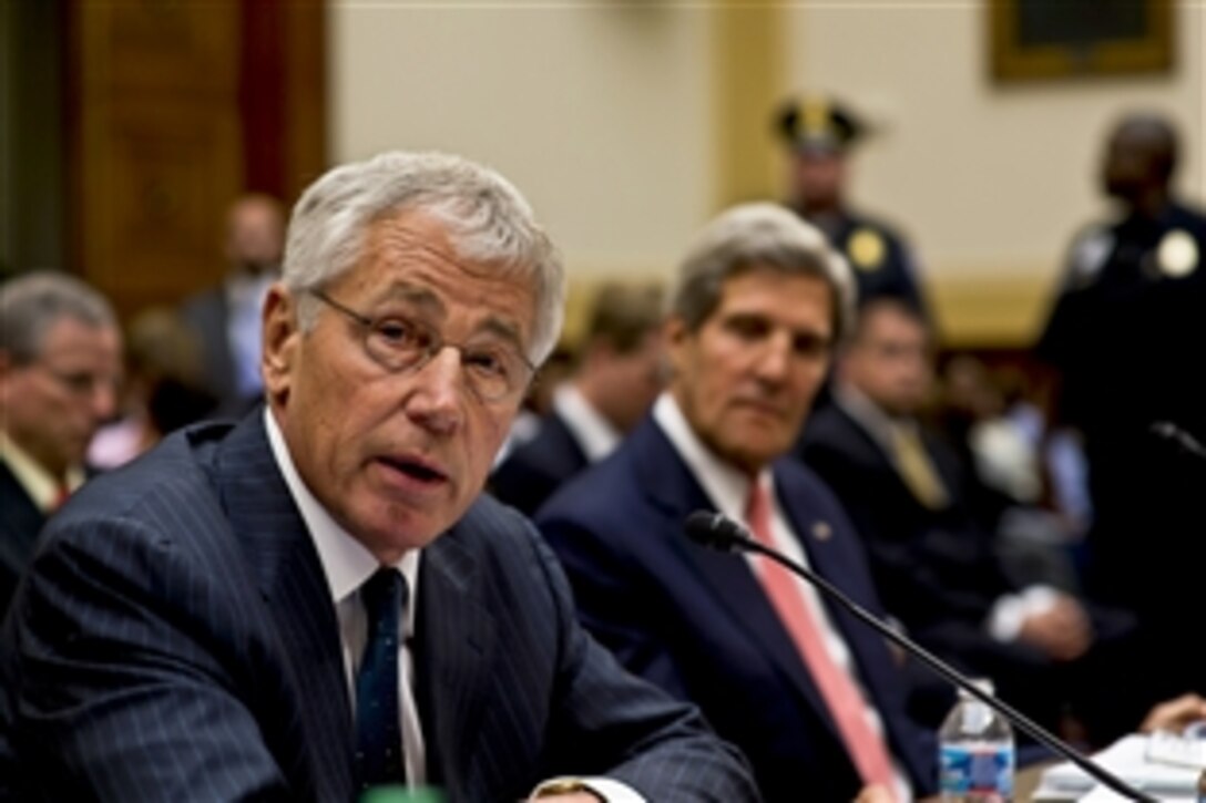 Defense Secretary Chuck Hagel testifies to support U.S. military intervention in Syria during a hearing before the House Foreign Affairs Committee in Washington, D.C., Sept. 4, 2013. Secretary of State John F. Kerry, right, and Army Gen. Martin E. Dempsey, not pictured, chairman of the Joint Chiefs of Staff, also testified.