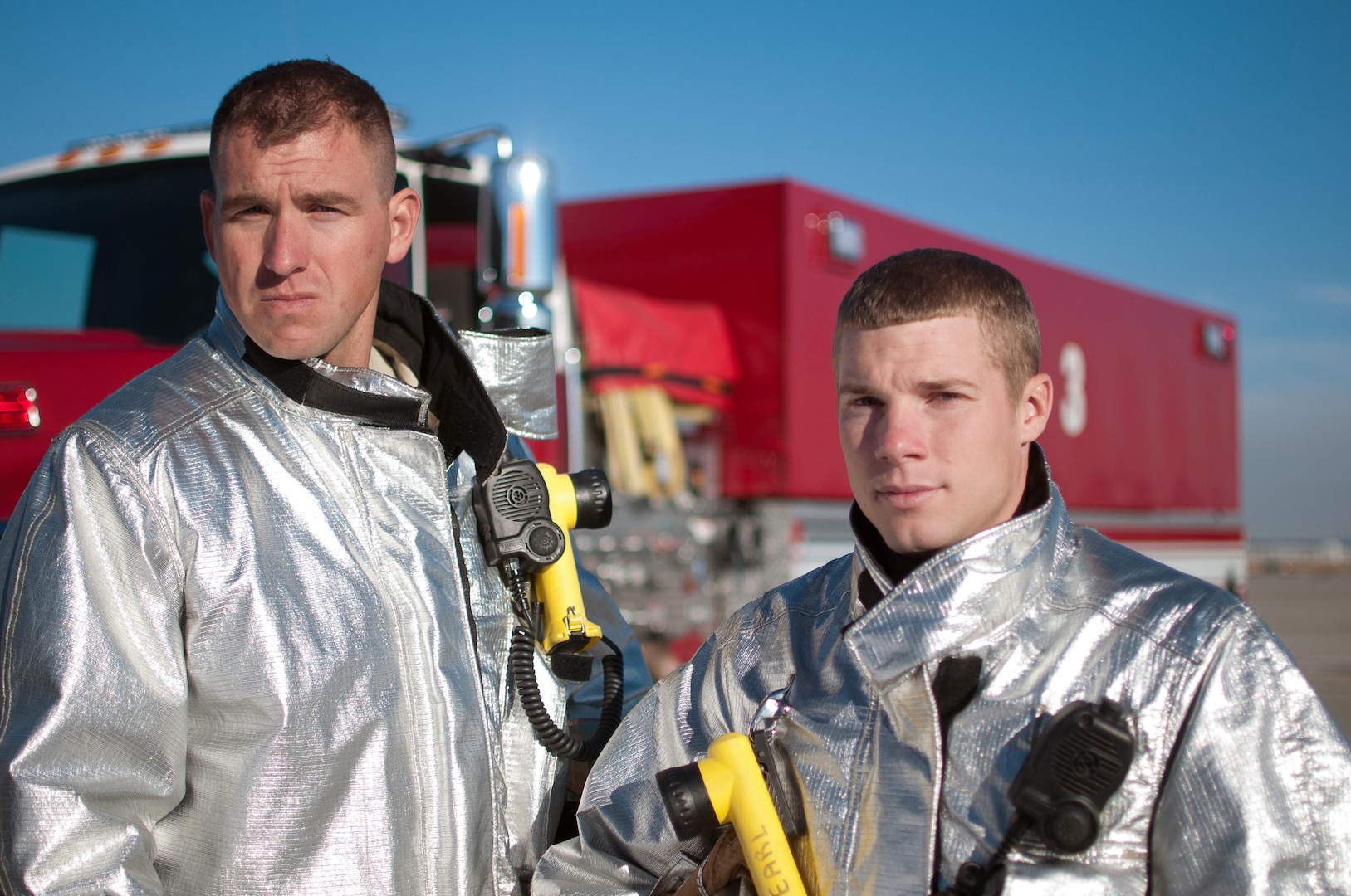 Staff Sgts. Damon Williams, left, and Jeffrey Sawmiller, 124th CEF, and the 4,000 gallon water tender responded to the off-base house fire that was caused by a charcoal grill Sept. 23.