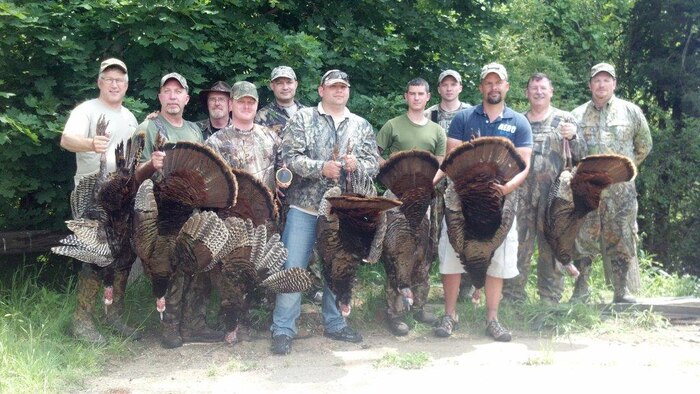 Wounded warriors pose with their kills and members of the Quantico Injured Military Sportsmen Association, who organized this 2013 spring turkey hunt. Numbers of turkeys on base are expected to be even higher this fall. 