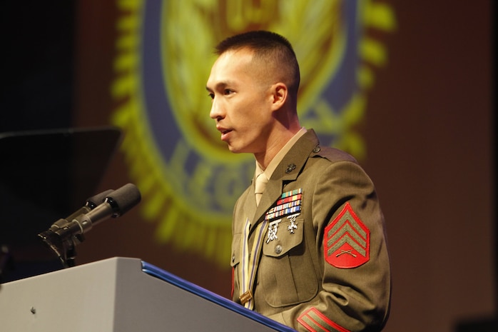 Sergeant Man Chan accepts the American Legion's Spirit of Service Award, in Houston, Aug. 27, 2013. Chan, the substance abuse control officer with 2nd Supply Battalion, Combat Logistics Regiment 25, 2nd Marine Logistics Group, received the award for 465 hours of volunteer work while serving in a challenging billet. (Official Marine Corps Photo by Sgt. B. A. Curtis)