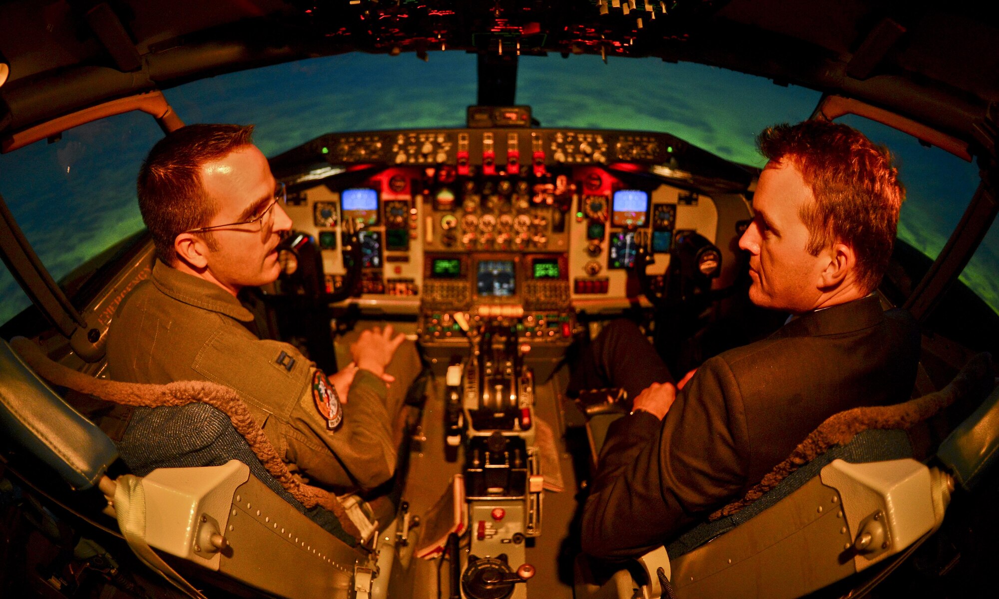 The Acting Secretary of the Air Force Eric Fanning receives lessons from Capt. Steven Whitson, a pilot instructor, in a flight simulator Aug. 29, 2013, at MacDill Air Force Base, Fla.,. The use of simulators are becoming more and more important due to increasing budget constraints. (U.S. Air Force photo/Ned T. Johnston)