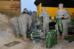 Massachusetts National Guardsmen fill sand bags Oct. 28, 2012, in preparation for Hurricane Sandy at the Massachusetts Department of Transportation facility.