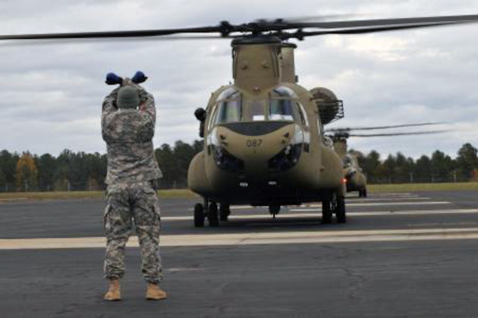 Chinooks from Alabama and Georgia National Guard refuel at North Carolina National Guard Flight Facility One before deploying in support of Hurricane Sandy.