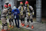 Soldiers from the 877th Engineer Company respond to a simulated large scale disaster situation as part of Vigilant Guard North Carolina, a training exercise that paired up National Guard elements with local and state first responders, at Fort Bragg, N.C.