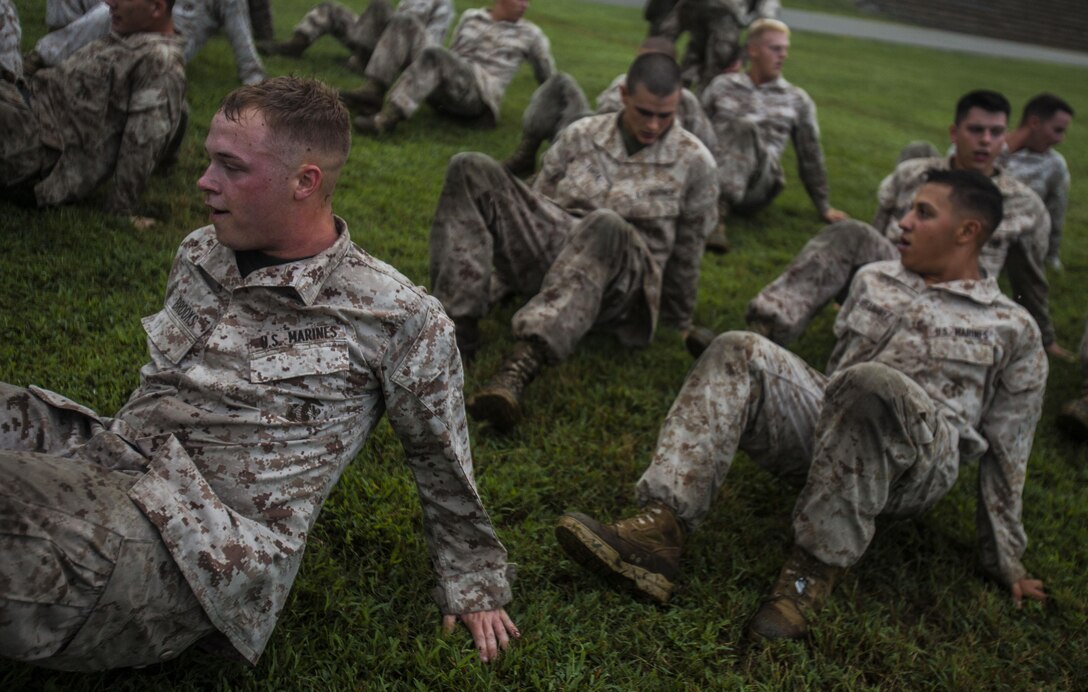 U.S. Marines with Battalion Landing Team 1st Battalion, 6th Marine Regiment, 22nd Marine Expeditionary Unit (MEU), back crawl during physical training before beginning a leadership reaction course at Fort Pickett, Va., Aug. 27, 2013. The Marines completed the course in order to increase their small-unit leadership skills as part of the MEU’s Realistic Urban Training exercise. The MEU is scheduled to deploy in early 2014 to the U.S. 5th and 6th Fleet areas of responsibility with the Bataan Amphibious Ready Group as a sea-based, expeditionary crisis response force capable of conducting amphibious missions across the full range of military operations. (U.S. Marine Corps photo by Sgt. Austin Hazard/Released)