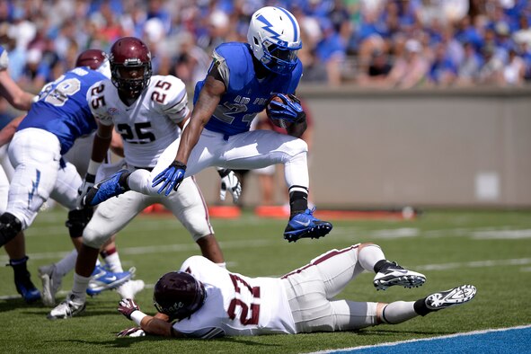 Junior running back Jon Lee leaps into the end zone for a touchdown during the U.S. Air Force Academy contest versus the Colgate Raiders Aug 31, 2013, at Falcon Stadium in Colorado Springs, Colo. The Falcons defeated the Raiders in their home opener, 38-13.  Lee, from Bethlehem, Ga., rushed for 130 yards and two touchdowns on 11 carries. (U.S. Air Force photo/Mike Kaplan)