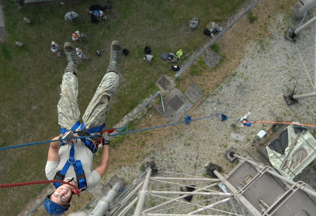 Airman 1st Class Jacob Slaght rappels from a water tower Sept. 4, 2013, at Royal Air Force Mildenhall, England. Firefighters practiced rappelling to train for real-world emergencies involving high-angle rescues. Trainers from the 435th Training and Construction Squadron, Ramstein Air Base, Germany, traveled to RAF Mildenhall to conduct the training. Slaught is a firefighter assigned to the 100th Civil Engineer Squadron Fire Department. (U.S. Air Force photo/Airman 1st Class Dillon Johnston)