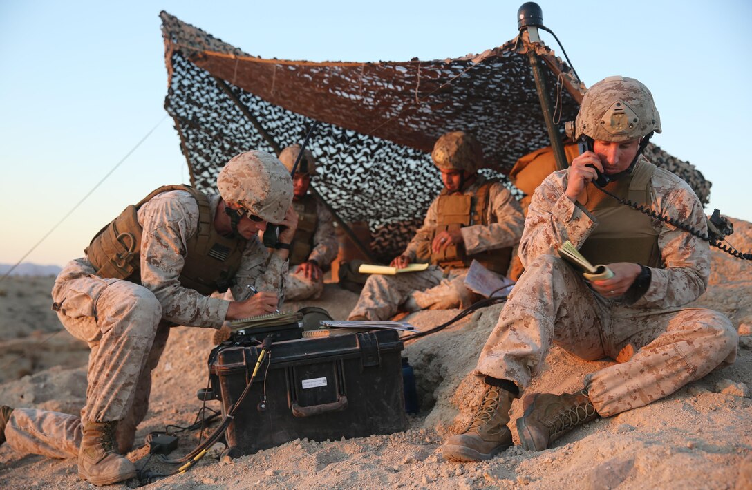 A team of joint terminal attack controllers with 3rd Air Naval Gunfire Liaison Company Marine Forces Reserve, based out of the Armed Forces Reserve Center in Bell, Calif., practice their calls for fire on precision targets at a range northwest of Marine Corps Air Station Yuma, Ariz., Aug. 13. As part of exercise Scorpion Fire, the 3rd ANGLICO team set out to hone their air-to-ground tactics and war fighting techniques in an environment that would simulate the conditions on the battlefield. (Photo by Cpl. Uriel Avendano)