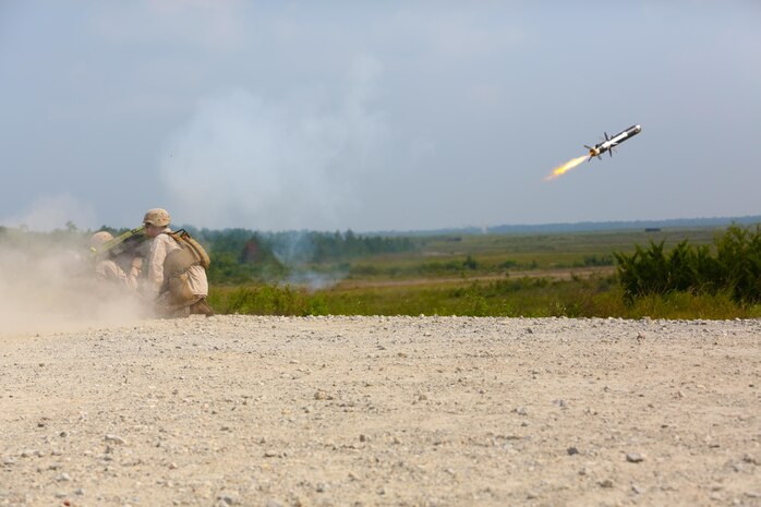 Sergeant Patrick Harrington, an anti-tank missileman with 2nd Battalion, 9th Marine Regiment, and Sgt. Michael Lesiewicz, also an anti-tank missileman with the unit, fire a FGM-148 Javelin during a live fire exercise aboard Marine Corps Base Camp Lejeune, Aug. 29, 2013. Six javelins and 19 BGM-71 Tube launched, Optically tracked, Wire-guided missiles (TOW missile) were fired in the training exercise.