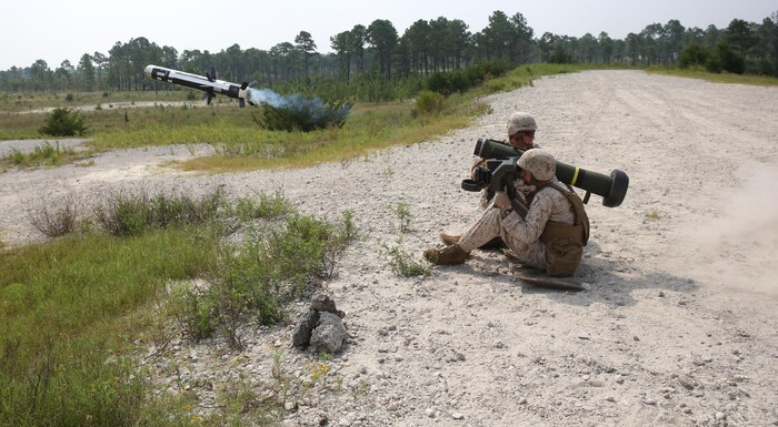 Sergeant Johnny Jernigan, an Anti-Tank Missileman with 2nd Battalion 9th Marine Regiment, fires the FGM-148 Javelin as his A–gunner, Cpl. James Darius makes sure the back blast area is clear. Although, Jernigan has fired two missiles in combat, this was the first missile that he has fired in training, although he has fired two missiles in combat.