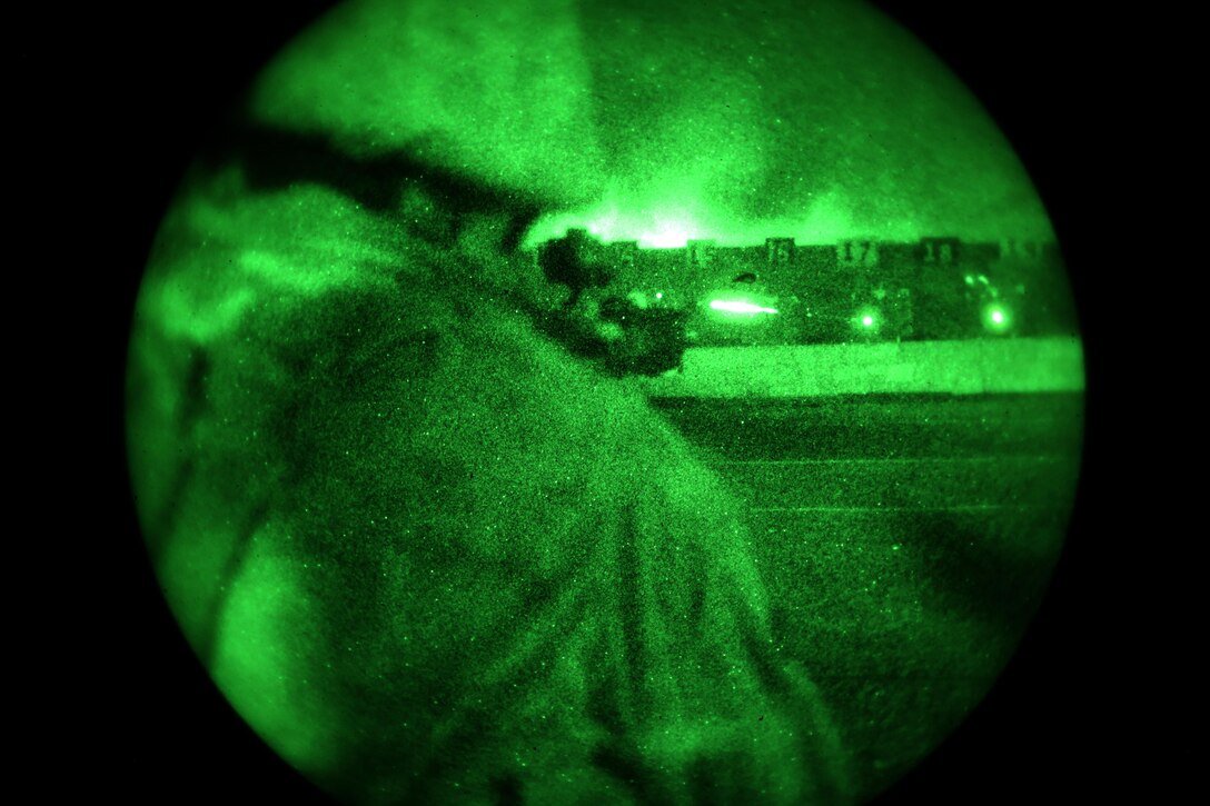 A Marine with Marine Wing Communications Squadron 38, Detachment A, uses night vision goggles and an infrared laser to fire upon his target during pre-deployment training aboard Marine Corps Air Station Miramar, Calif., Aug. 28. NVGs and infrared lasers help Marines overcome the challenges of acquiring and firing on targets in the dark.