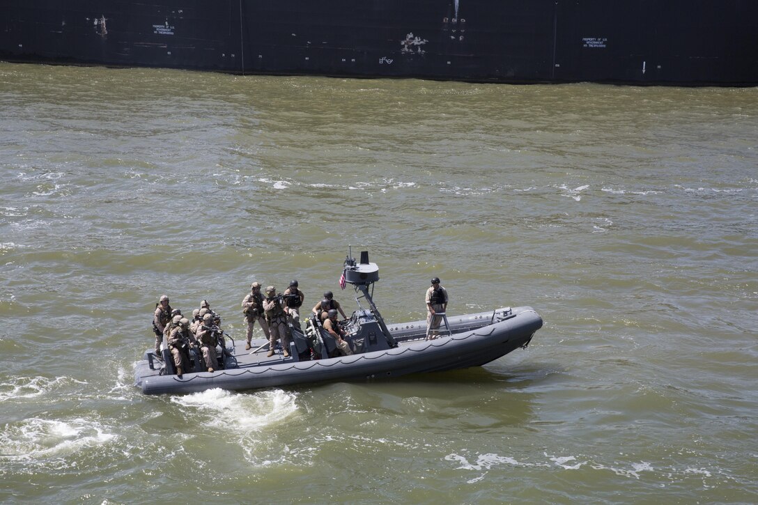 U.S. Marines and Sailors with the 22nd Marine Expeditionary Unit (MEU)’s maritime raid force (MRF) provide security on Joint Base Langley-Eustis, Va., Aug. 24, 2013. Marines and Sailors with the MRF practiced boarding and clearing a ship during the visit, board, search and seizure portion of the MEU’s Realistic Urban Training exercise. The MEU is scheduled to deploy in early 2014 to the U.S. 5th and 6th Fleet areas of responsibility with the Bataan Amphibious Ready Group as a sea-based, expeditionary crisis response force capable of conducting amphibious missions across the full range of military operations. (U.S. Marine Corps photo by Sgt. Alisa J. Helin/Released) 
