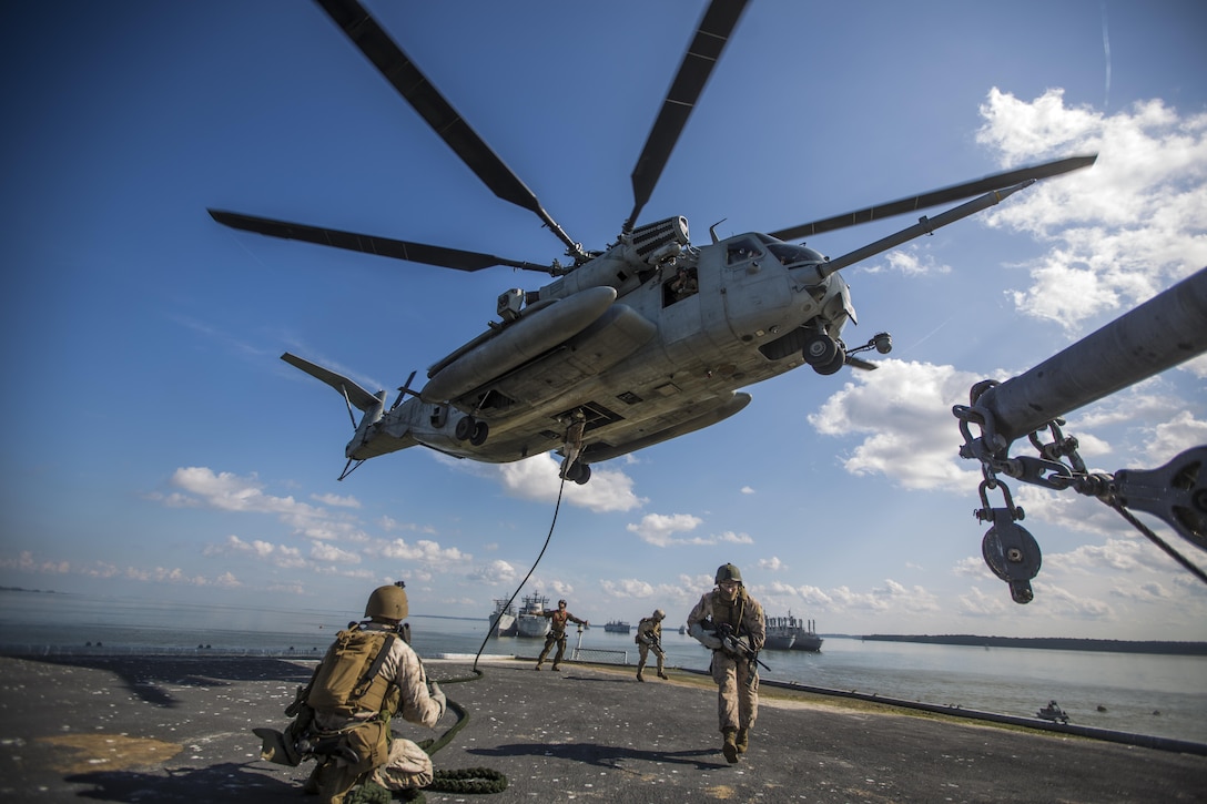 U.S. Marines and Sailors with the 22nd Marine Expeditionary Unit (MEU)’s maritime raid force (MRF) fast rope from a CH-53E Super Stallion aircraft to the S.S. Cape Avinoff at Joint Base Langley-Eustis, Va., Aug. 22, 2013. Marines and Sailors with the MRF practiced boarding and clearing the ship as part of a visit, board, search and seizure course. The MEU is scheduled to deploy in early 2014 to the U.S. 5th and 6th Fleet areas of responsibility with the Bataan Amphibious Ready Group as a sea-based, expeditionary crisis response force capable of conducting amphibious missions across the full range of military operations. (U.S. Marine Corps photo by Lance Cpl. Joshua M. Rudy/Released)