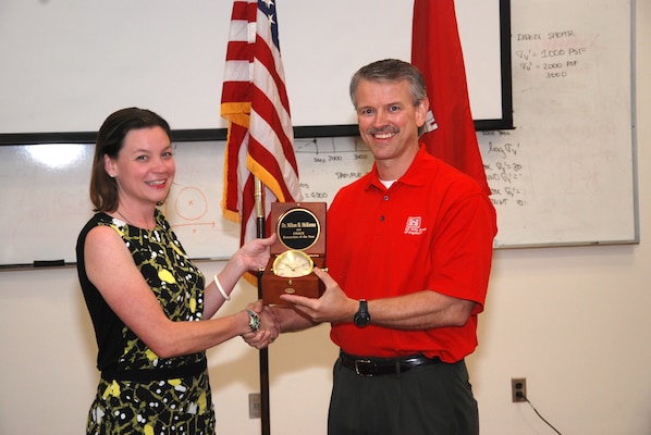 Dr. Mihan McKenna accepts the USACE Researcher of the Year Award. 