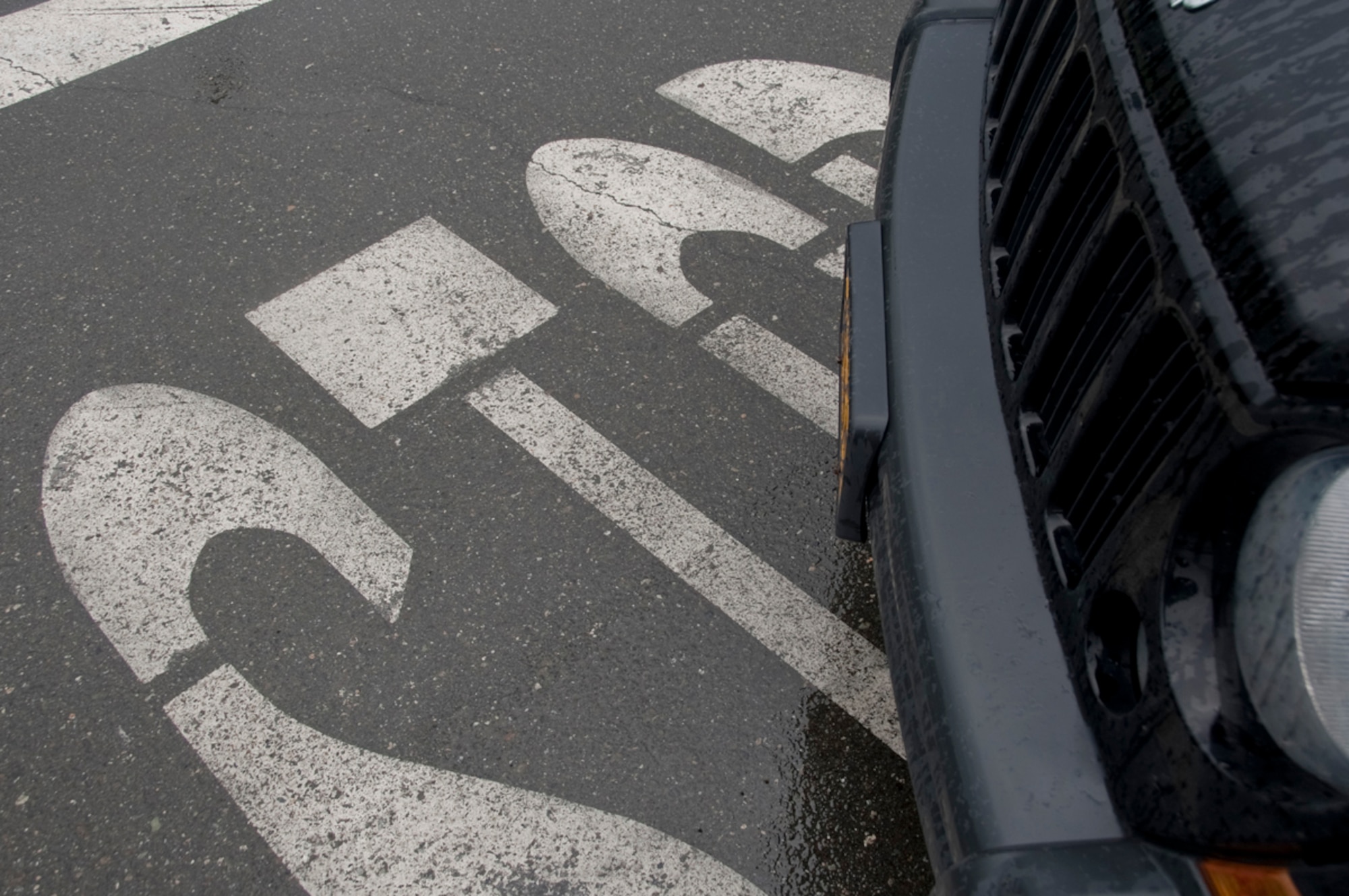 A Jeep Liberty stops in the parking lot of the Joint Base Elmendorf-Richardson Joint Military Mall, Sept. 4, 2013.  There have been a total of 263 reported vehicle accidents on JBER this year. More than 90 percent of these accidents occur in parking lots due to speeding and inattentive driving.(U.S. Air Force photo/Staff Sgt. William Banton)