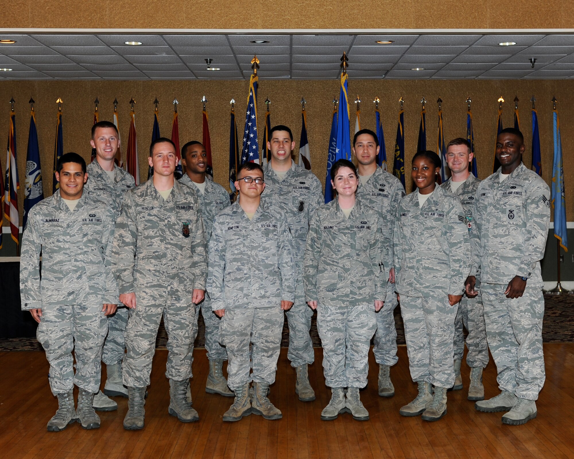 Eleven of Team BLAZE’s newly promoted enlisted Airmen sewed on their next stripe at the enlisted promotions ceremony at the Columbus Club on Aug. 30. (U.S. Air Force photo/Elizabeth Owens)