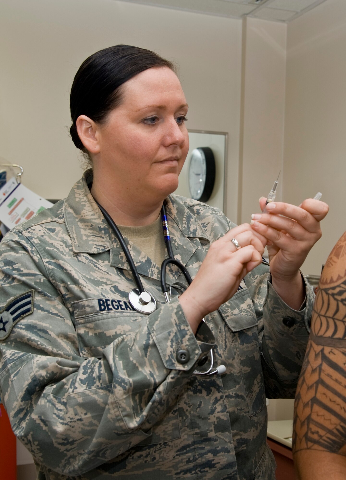Senior Airman Christina Begeal, 22nd Medical Operations Squadron aerospace medical technician, prepares to administer a saline training shot Sept. 3, 2013, at McConnell Air Force Base Kan. Aerospace medical technicians specialize in caring for patients and assisting doctors. Begeal was selected as the 22nd Air Refueling Wing spotlight performer for the week of Sept. 2 to 6. (U.S. Air Force Photo/Airman 1st Class John Linzmeier)