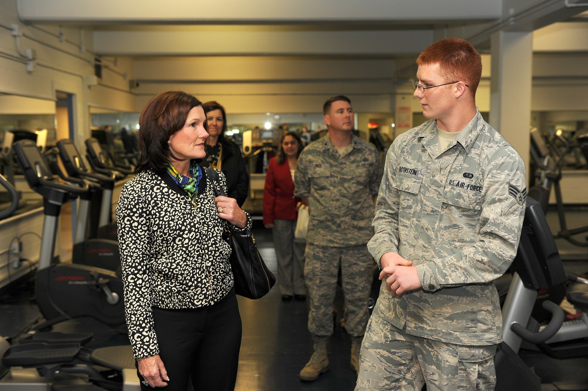 Senior Airman John Rothstein, 354th Force Support Squadron fitness specialist, briefs Betty Welsh, wife of Air Force Chief of Staff Gen. Mark A. Welsh III, Aug. 30, 2013, Eielson Air Force Base, Alaska. As part of the general’s two-week tour of the Pacific, Welsh and Athena Cody, wife of Chief Master Sgt. of the Air Force James Cody, met with spouses and families about programs and specific issues related to family care in the region. (U.S. Air Force photo by Mr. Scott Ash/Released)