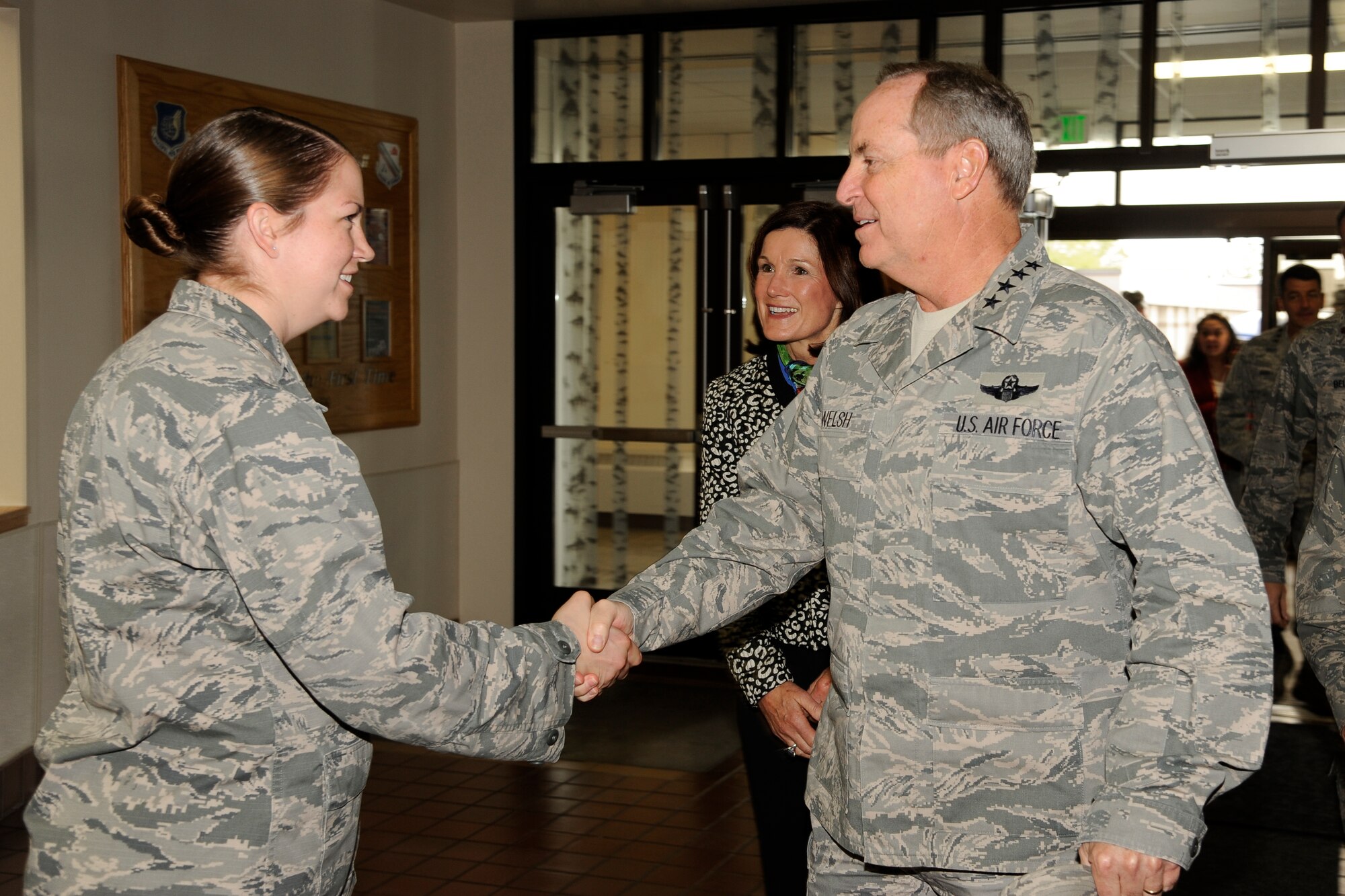 U.S. Air Force Capt. Kirstan Pyle, 354th Medical Group registered nurse, greets Air Force Chief of Staff Gen. Mark A. Welsh III at the Eielson City Center Aug. 30, 2013, Eielson was the final stop on a two-week long tour of the Pacific region in which he discussed Air Force key issues and opportunities and challenges in the region.  Welsh, along with his wife, Betty, and Athena Cody, wife of Chief Master Sgt. of the Air Force James Cody, met with Airmen and their families at various locations on the base to thank them for their dedication and sacrifice.  (U.S.Air Force photo by Airman 1st Class Peter Reft/Released)