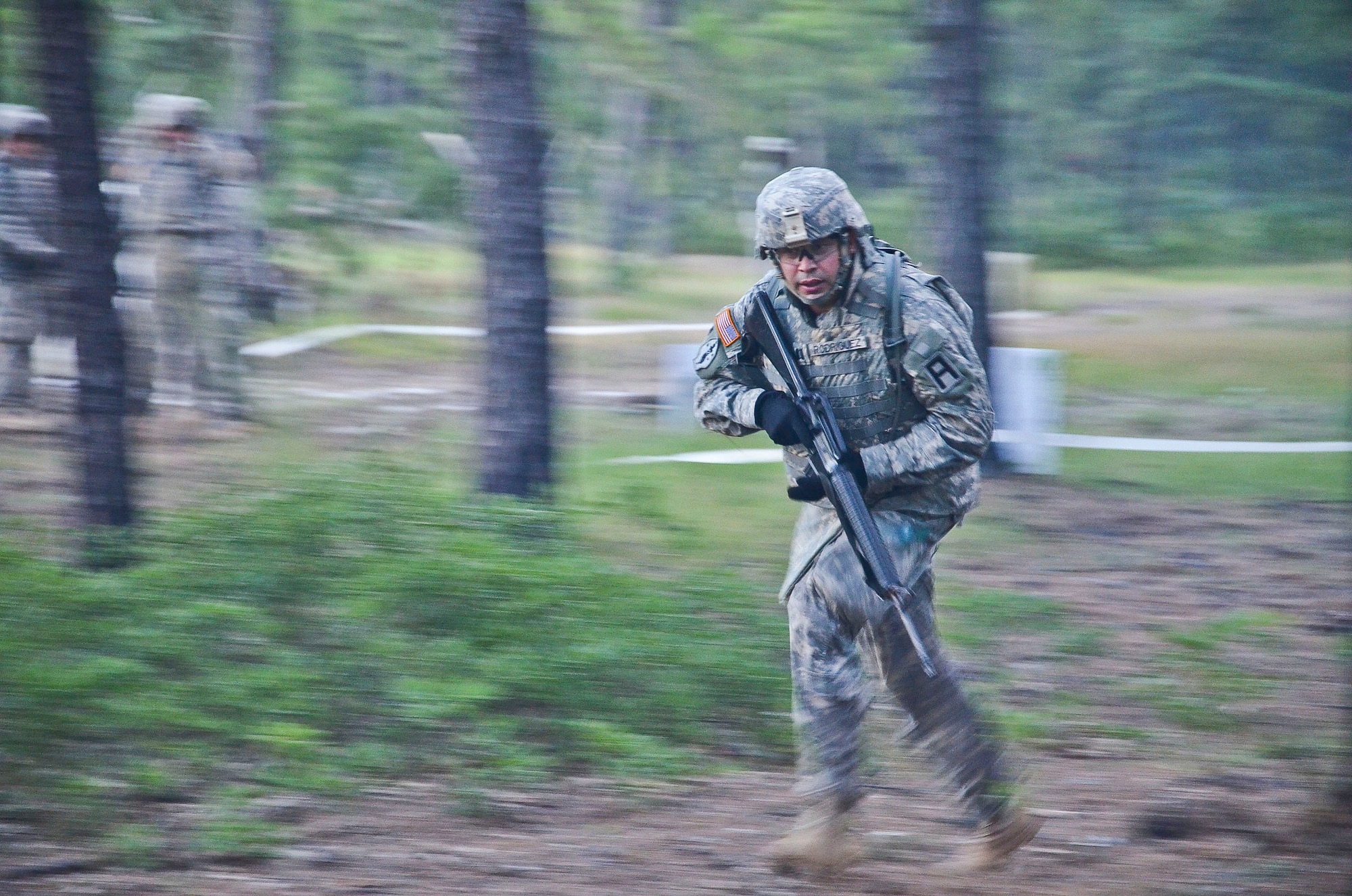 Capt. Johanny Rodriguez, 2-309th Regiment, runs through the woods as part of the React to Indirect Fire exercise during the 174th Infantry Brigade’s Best Officer Competition, Aug. 26-28, 2013, at Joint Base McGuire-Dix-Lakehurst.  Brigade officers were tested on various skills, including Army Warrior Tasks and physical fitness challenges, throughout the course of the competition. (U.S. Army photo by Sgt. 1st Class Raymond Alston/Released)