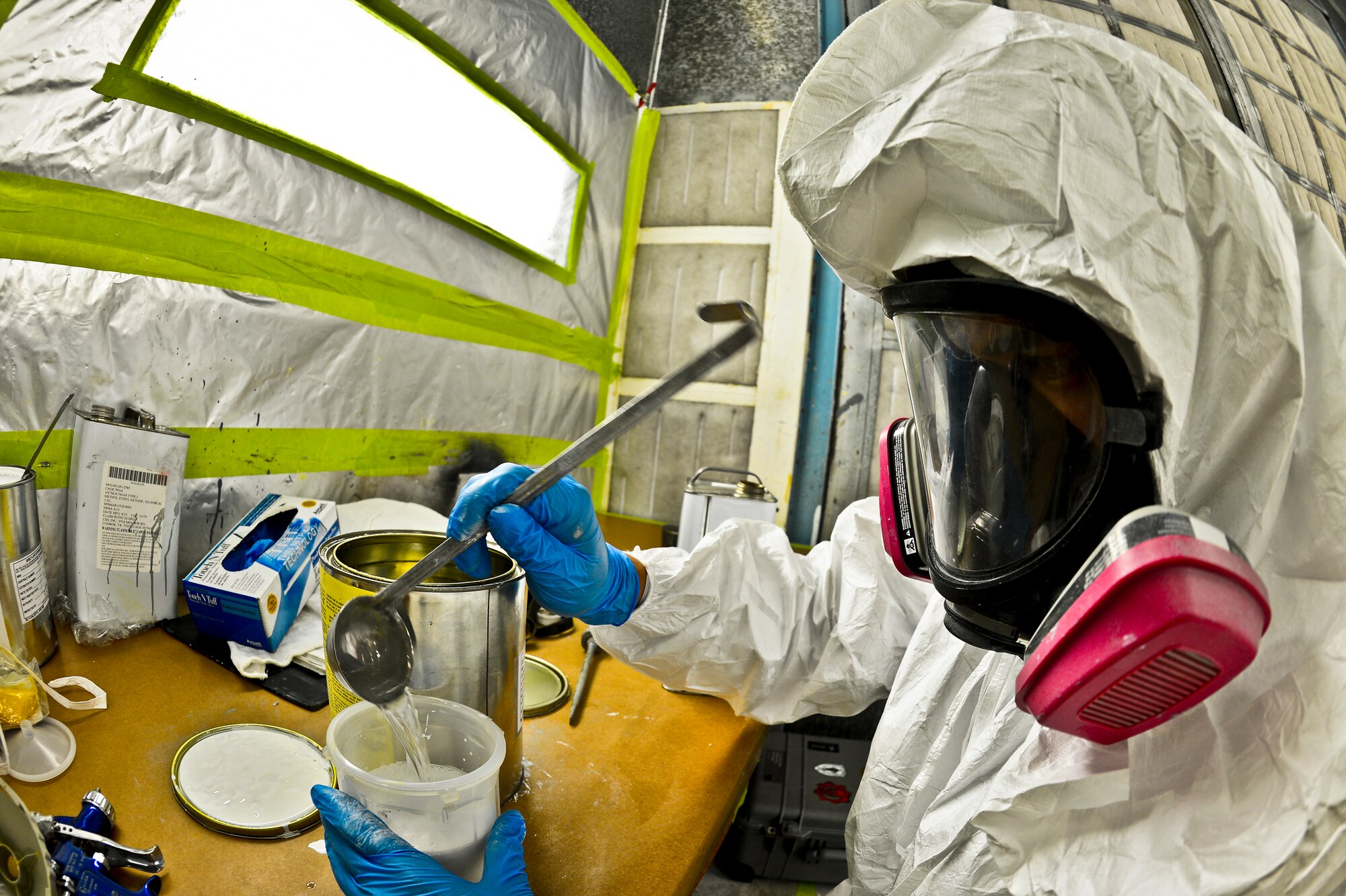 Airman 1st Class Eric Martinez, 6th Maintenance Squadron aircraft structural maintenance technician, mixes up a paint solution on Aug 27, 2013, MacDill Air Force Base, Fla. Martinez’s solution was used on a set of KC-135 Stratotanker wheels that needed a new corrosion preventative coating. (U.S. Air Force photo/Staff Sgt. Brandon Shapiro/Released)
