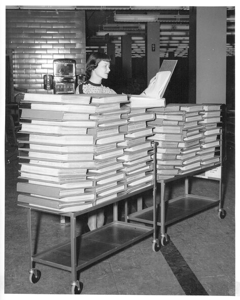 An Air Reserve Records Center employee working with address record books at the York Street building, Denver, Colo., in 1954. ARRC officially opened its doors March 1, 1954, almost 60 years ago. It wasn't until Sept. 1, 1965, that it was renamed the Air Reserve Personnel Center due to increasing involvement in all areas of personnel management and not only records. ARPC will celebrate their 60th birthday on Feb. 28, 2014. (U.S. Air Force photo)

