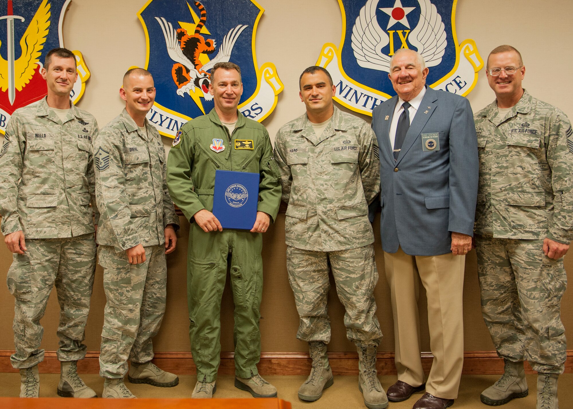 Members of the Air Force Sergeants Association (AFSA) gather for a group photo following the addition of their newest member, U.S. Air Force Col. Chad Franks, 23d Wing commander, at Moody Air Force Base, Ga., Sept. 4, 2013. Retired Chief Master Sgt. Joe Spence, former AFSA International President from 1980 to 1982, visited Moody’s AFSA Chapter 460, and attended the presentation for Franks. (U.S. Air Force photo by Senior Airman Eileen Meier/Released)