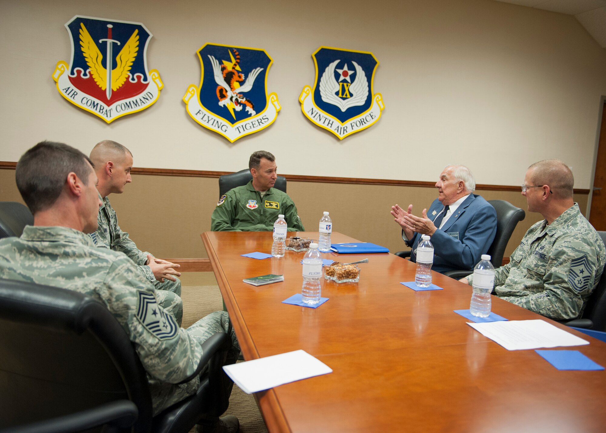 U.S. Air Force Col. Chad Franks, 23d Wing commander, speaks with retired Chief Master Sgt.  Joe Spence, former Air Force Sergeants Association (AFSA) International President from 1980 to 1982, and members of Moody’s AFSA Chapter 460 at Moody Air Force Base, Ga., Sept. 4, 2013. During Spence’s visit Tech. Sgt. Steven Haro, Moody AFSA Chapter 460 president, and Master Sgt. Mark Diehl, vice president, presented Franks with an AFSA membership and certificate of appreciation for supporting the enlisted force. (U.S. Air Force photo by Senior Airman Eileen Meier/Released)
