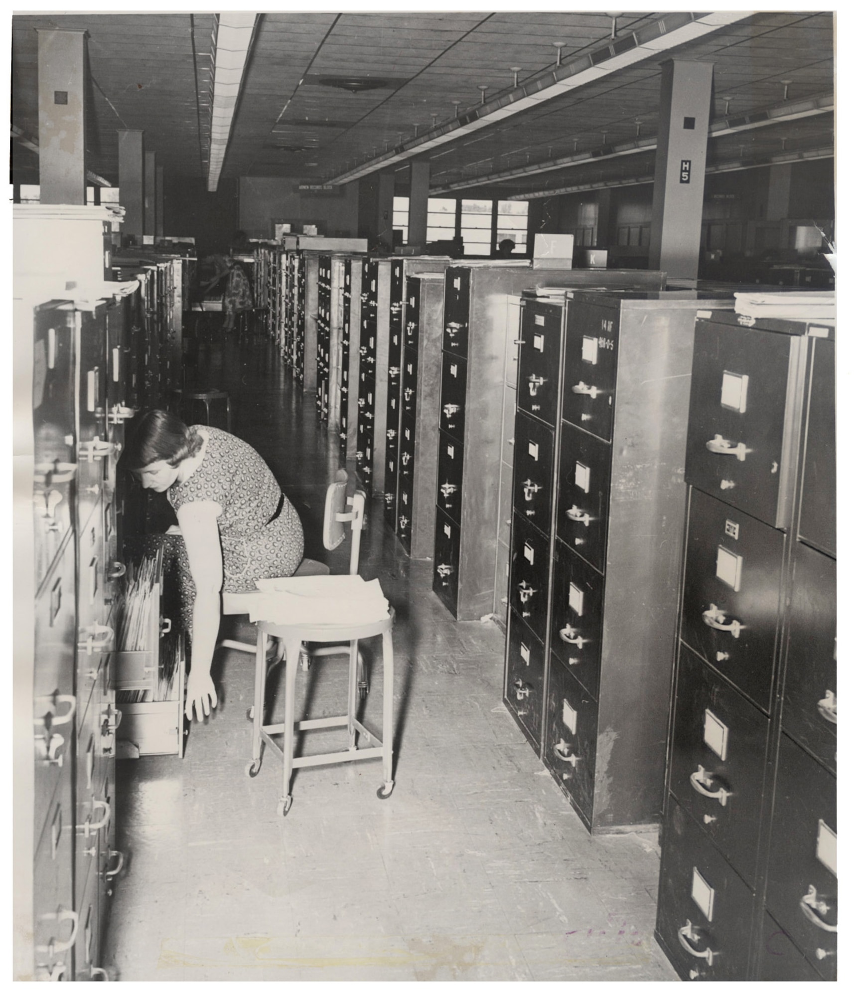 An Air Reserve Records Center employee files records in the file cabinet bank at the York Street building, Denver, Colo., in 1955. ARRC officially opened its doors March 1, 1954, almost 60 years ago. It wasn't until Sept. 1, 1965, that it was renamed the Air Reserve Personnel Center due to increasing involvement in all areas of personnel management and not only records. ARPC will celebrate their 60th birthday on Feb. 28, 2014.