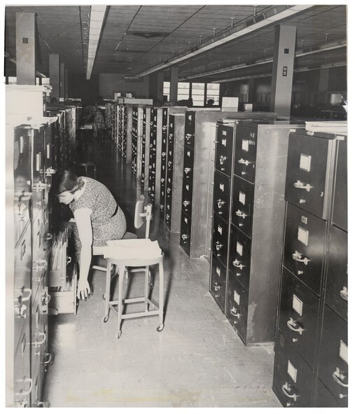 An Air Reserve Records Center employee files records in the file cabinet bank at the York Street building, Denver, Colo., in 1955. ARRC officially opened its doors March 1, 1954, almost 60 years ago. It wasn't until Sept. 1, 1965, that it was renamed the Air Reserve Personnel Center due to increasing involvement in all areas of personnel management and not only records. ARPC will celebrate their 60th birthday on Feb. 28, 2014. (U.S. Air Force photo)

