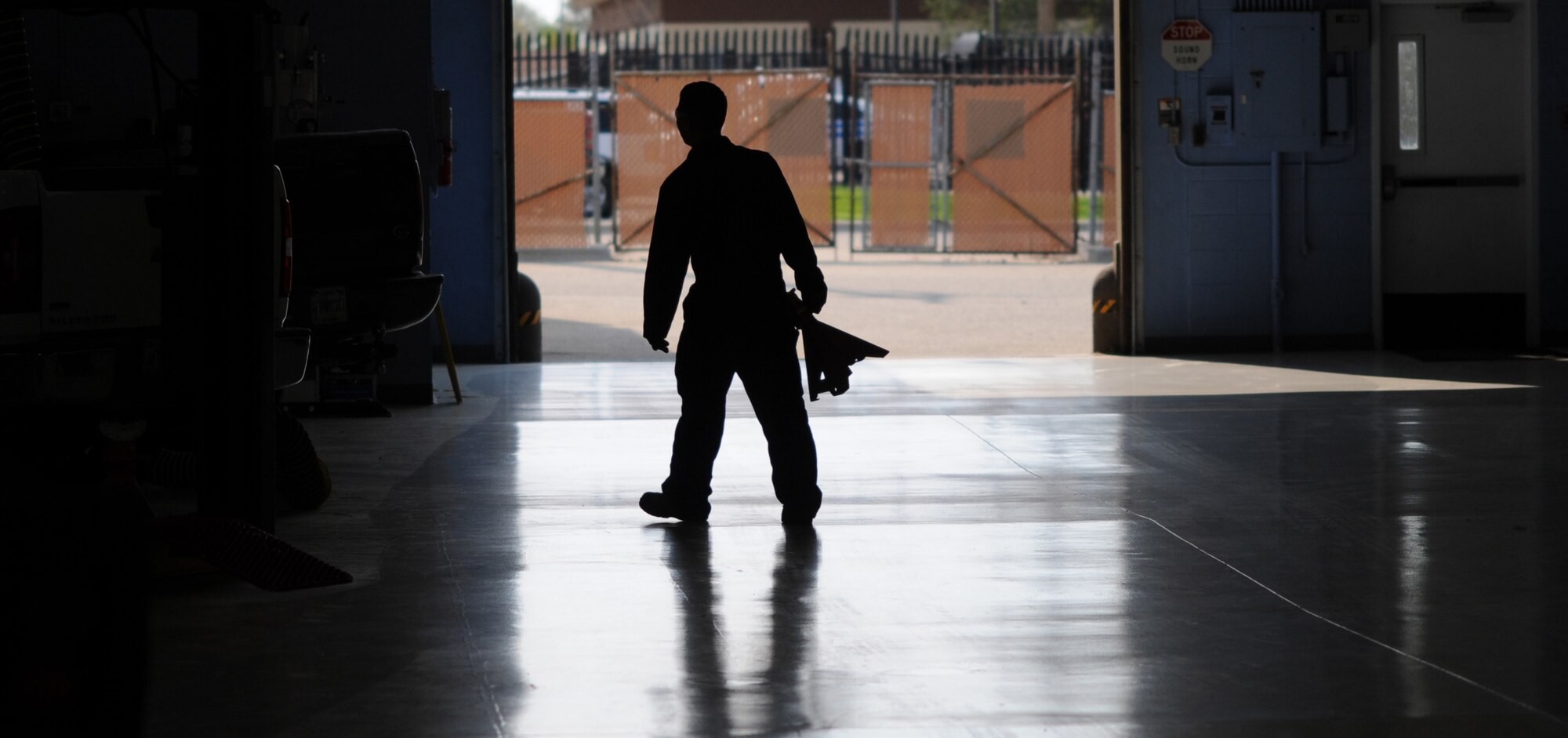An Airman from the vehicle maintenance section of the 366th Logistics Readiness Squadron retrieves a jack stand Aug. 26, 2013, at Mountain Home Air Force Base, Idaho. These Airmen demand the highest standards of safety for themselves as well as for their customers and strive to ensure the vehicle fleet remains in serviceable condition. (U.S. Air Force photo by Senior Airman Benjamin Sutton/Released)