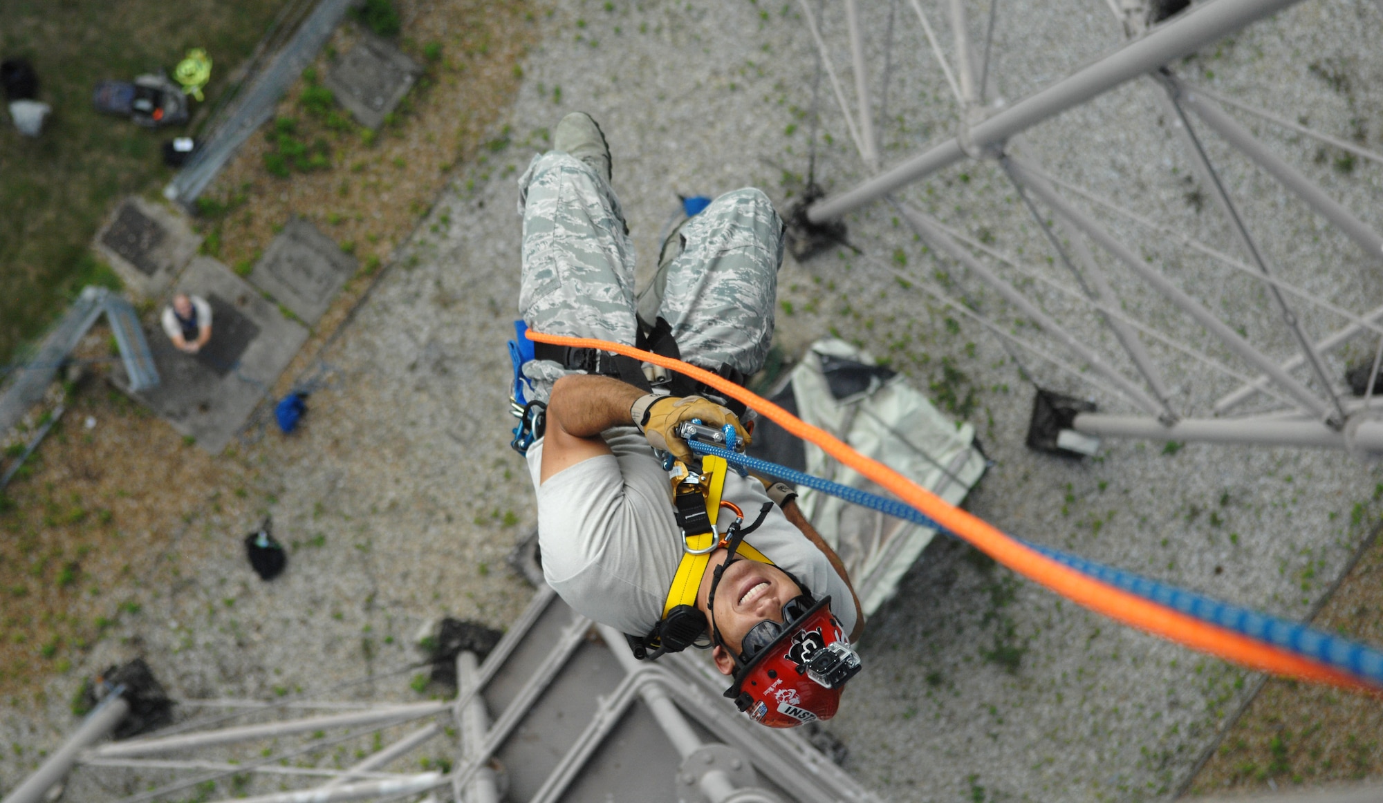 U.S. Air Force Tech. Sgt. James Hickman, 435th Construction and Training Squadron, Ramstein Air Base, Germany, fire and rescue contingency instructor, rappels from a water tower Sept. 4, 2013, on RAF Mildenhall, England. Hickman traveled to RAF Mildenhall to teach base firefighters correct rappelling procedures. The rappelling was part of the high-angle portion of the firefighters’ technical rope rescue course. (U.S. Air Force photo by Airman 1st Class Dillon Johnston/Released)