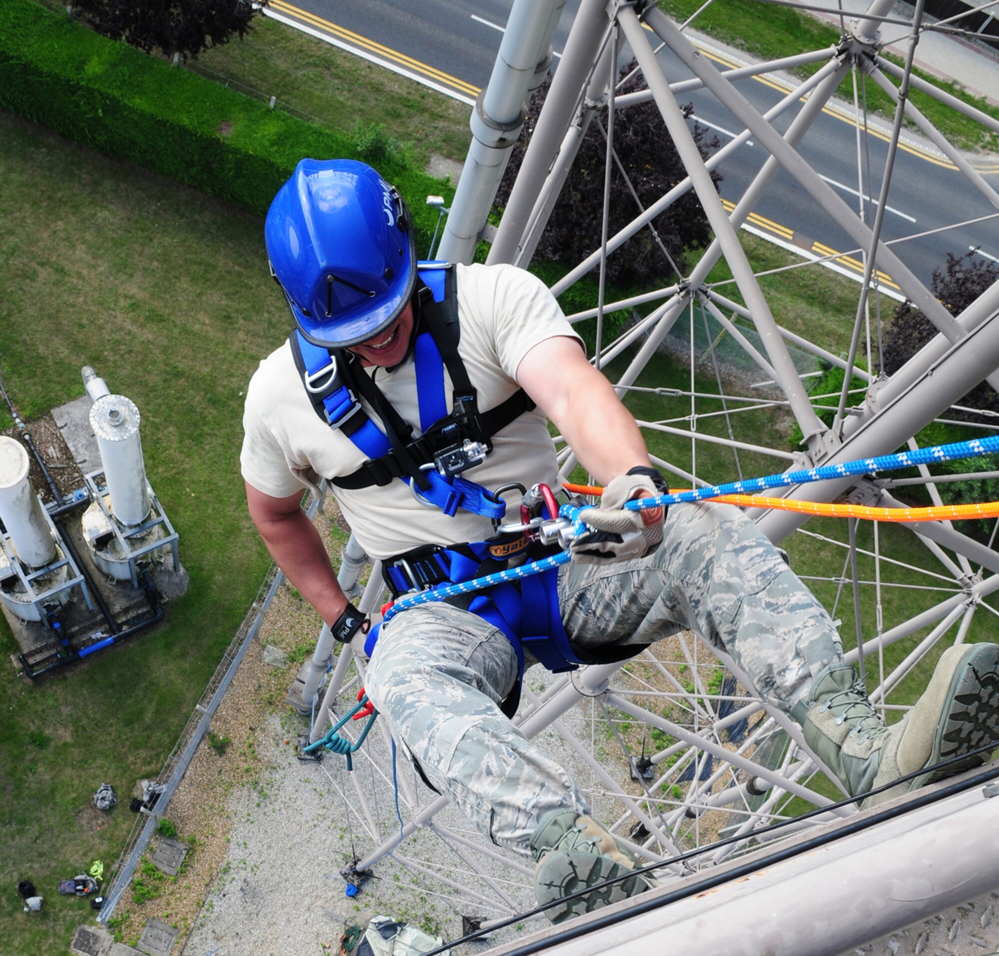 U.S. Air Force Staff Sgt. Noel Rivera-Saldena, 100th Civil Engineer Squadron Fire Department firefighter from Lake Mary, Fla., rappels from the top of a water tower, 120-feet above the ground, during a technical rope rescue training session Sept. 4, 2013, on RAF Mildenhall, England. This training is vital in teaching firefighters how to rappel from high buildings or facilities and provides them the knowledge of how to lower a casualty on a rope. (U.S. Air Force photo by Karen Abeyasekere/Released)
